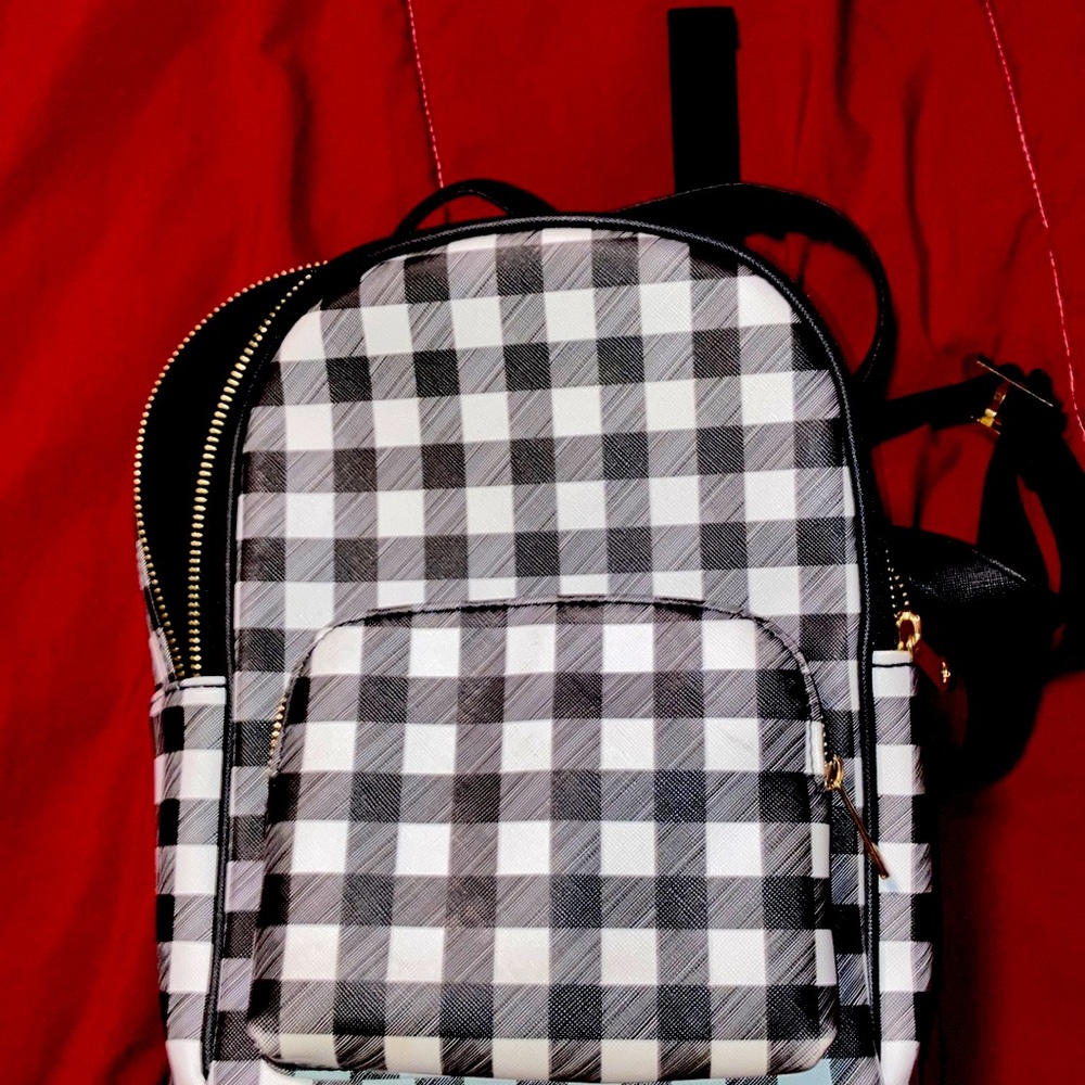 Plaid black and white mini backpack.